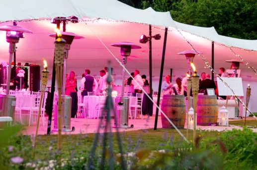 White Stretch Tent with pink lighting