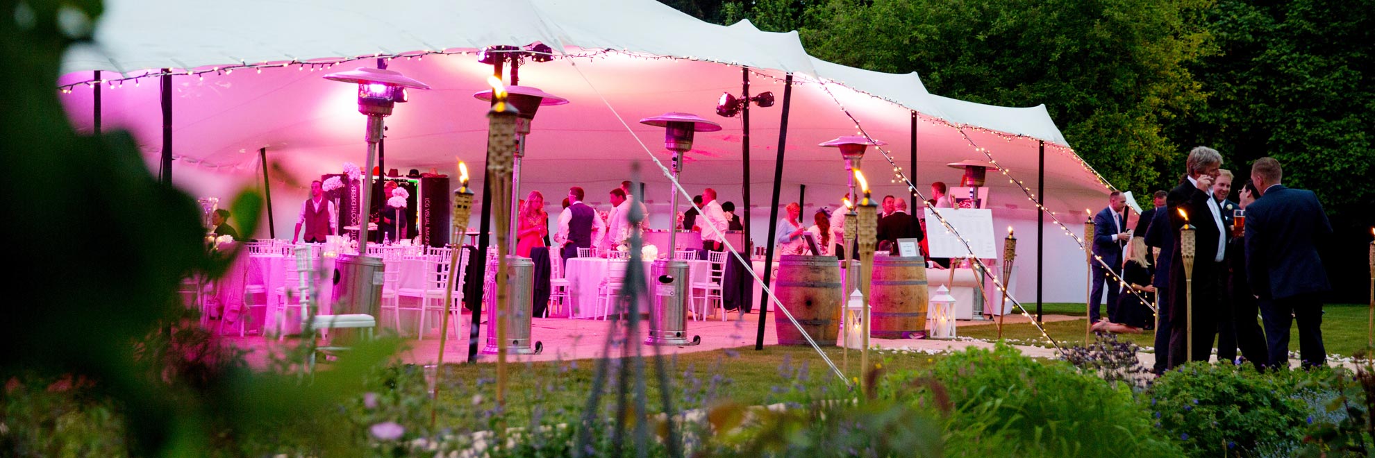 White Stretch Tent with pink lighting